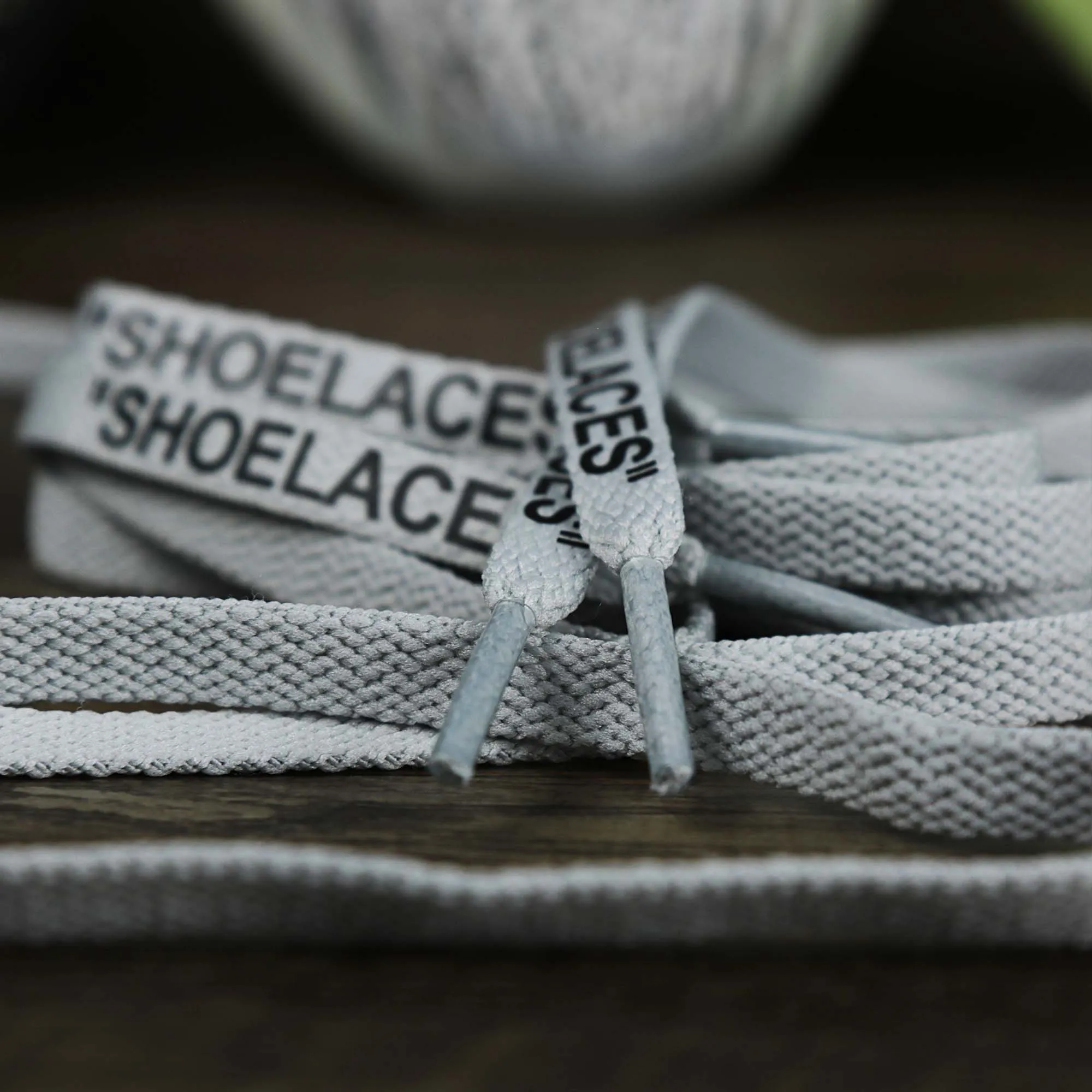 Flat Icey Grey Shoelaces with “Shoelaces” Print | 120cm Capswag